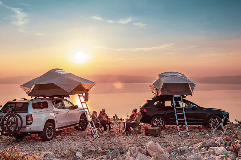 yakima skyrise on roof tents on vehicles by the sea